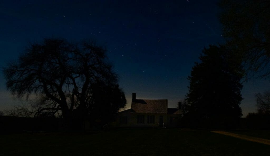house under starry night sky